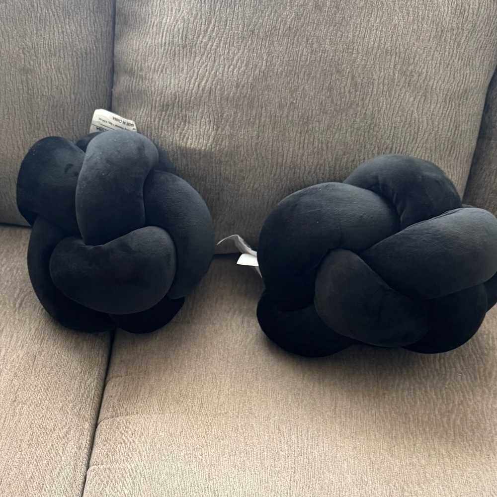 2 black knot throw pillows